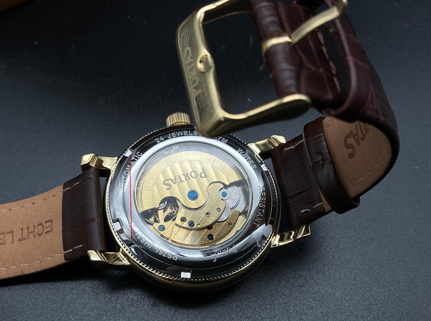 Gold-graue Portas Uhr